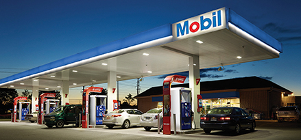 Mobil station glows at nighttime.